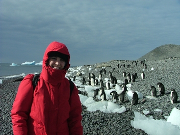 Auburn student with penguins in Antarctica