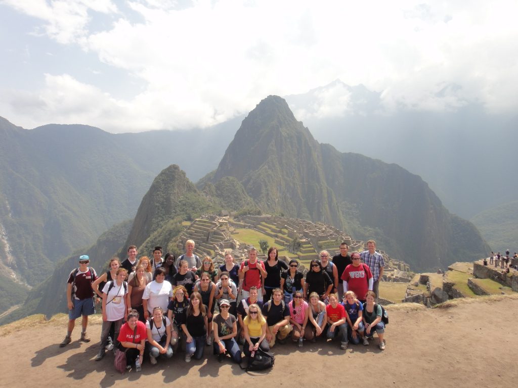 Auburn students gathered with Machu Picchu in the background