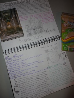 close up of notebook with travel notes, drawings and pictures